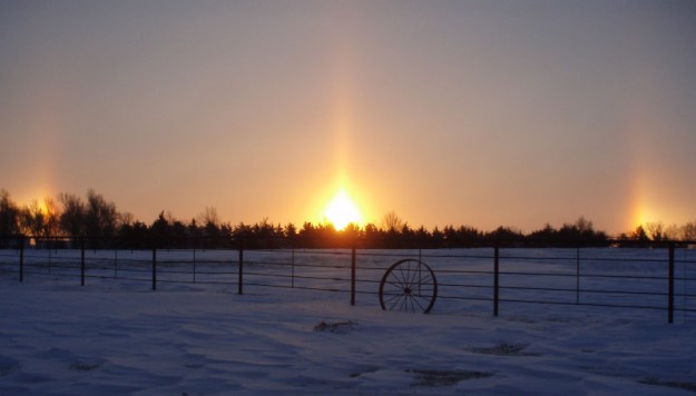 Kansas sunrise with double sundogs. I would much rather have the "dog days of summer" than winter! I guess it's mother nature's way of showing us the beauty in the 12 inches of snow.